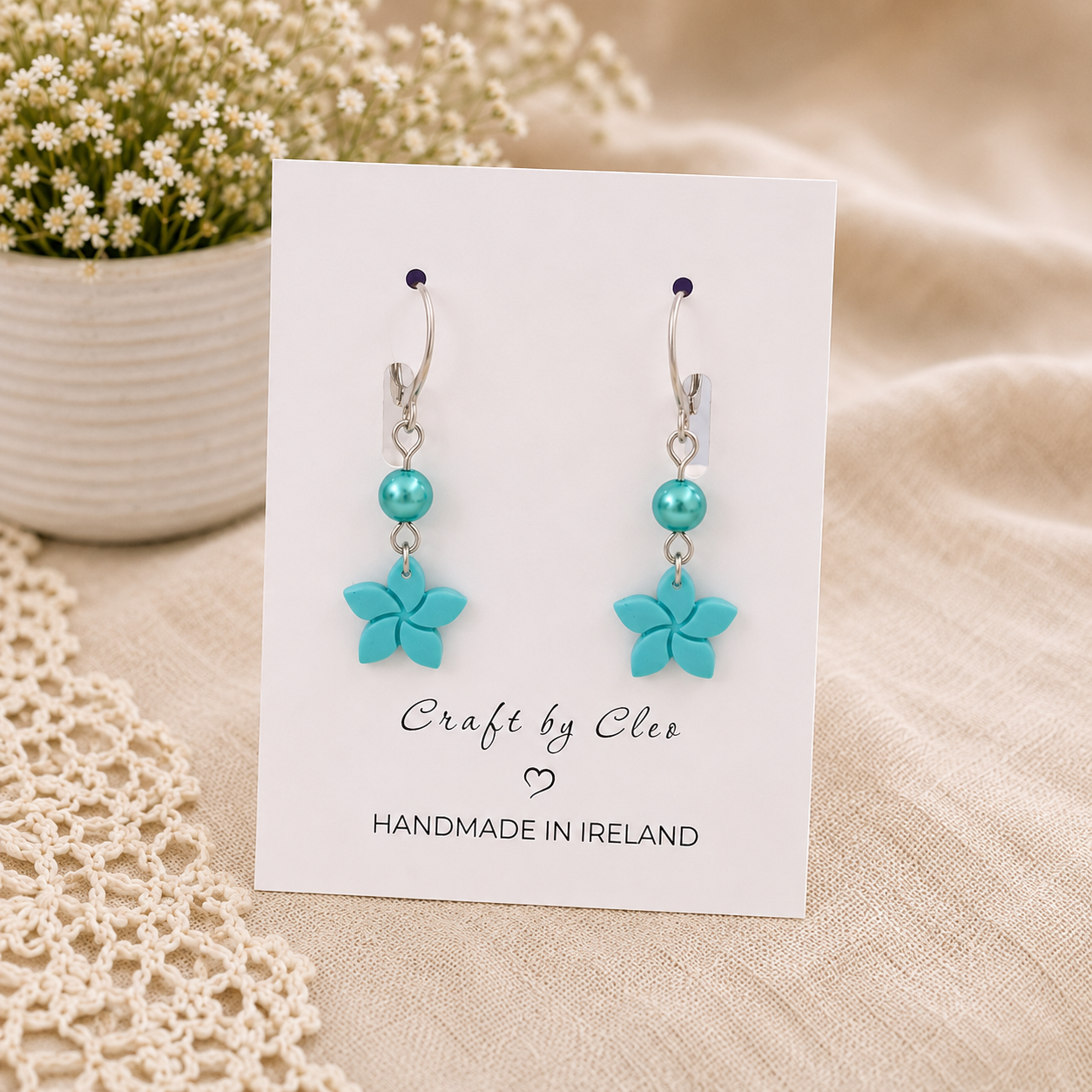 Forget Me Not polymer clay earrings with pearl accent.