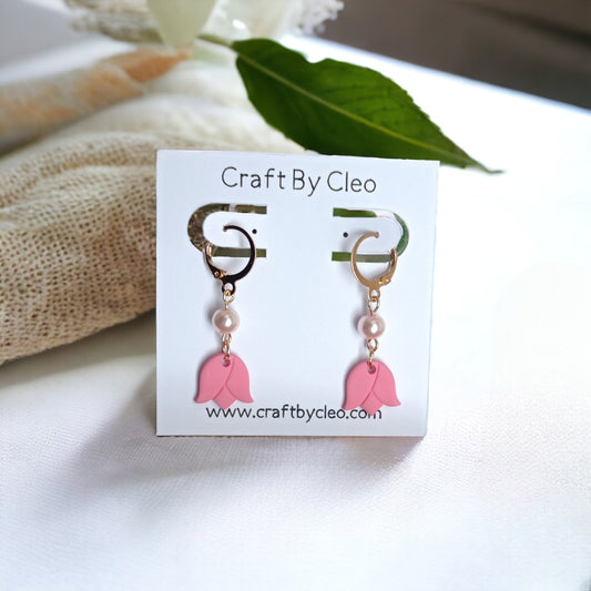 Cute tiny tulip polymer clay earrings with pearl accent.