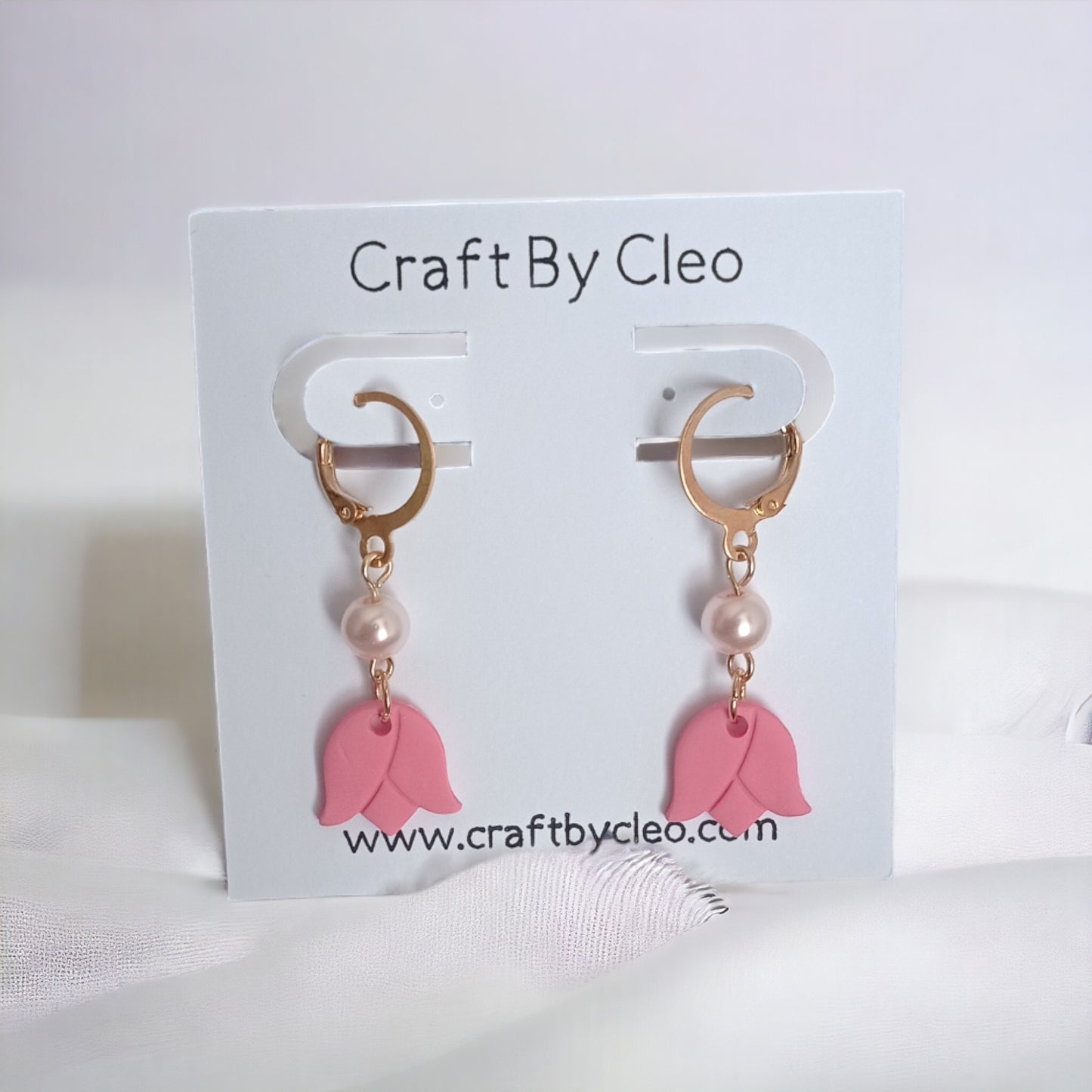 Cute tiny tulip polymer clay earrings with pearl accent.